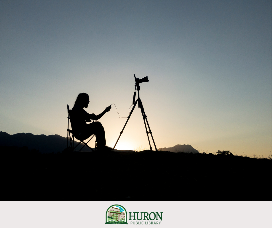 Man on Hill with Video Camera silhouette