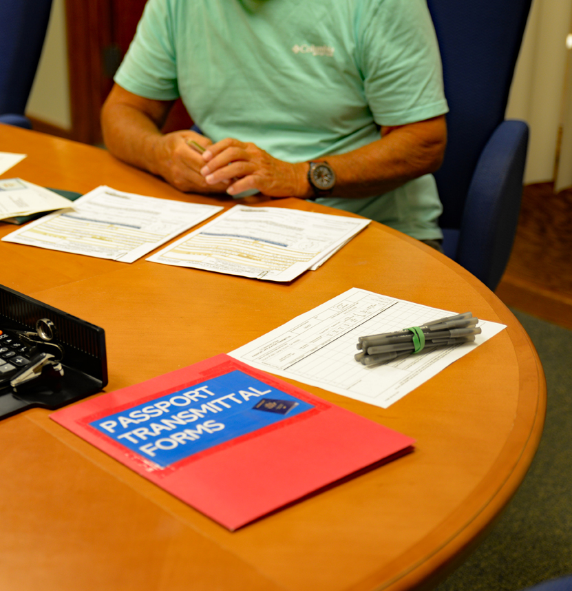 Image of man sitting in a Passport appointment
